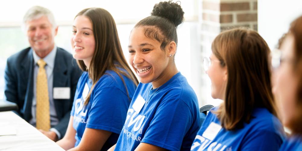 Thompson Scholar students smiling and talking with each other